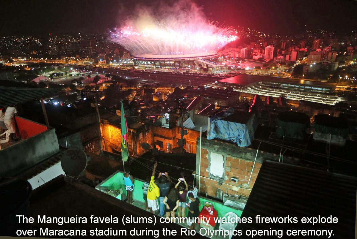 the-mangueira-favela-community-watches-fireworks-explode-over-maracana-stadium-during-the-rio-olympics-opening-ceremony